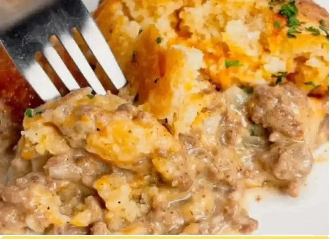 Cheddar Bay Ground Beef Cobbler served in a rustic dish with a golden biscuit topping