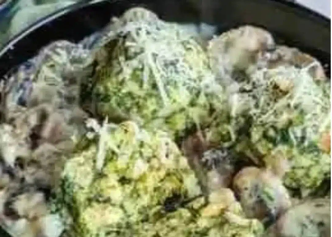 Delicious Spinach Dumplings served with creamy mushroom sauce